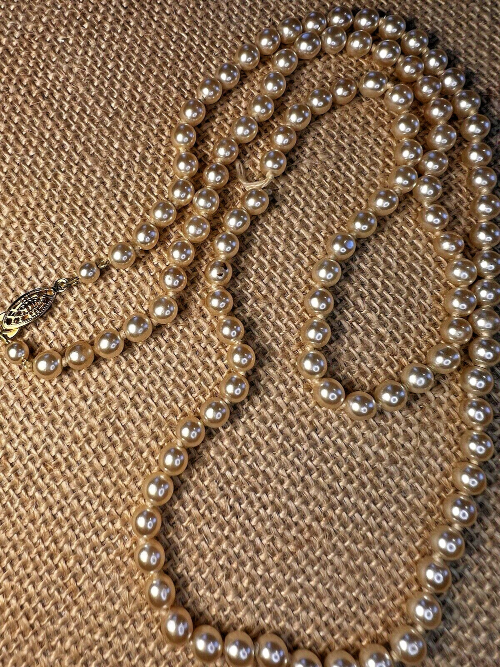 Strand (Broken) of Knotted Faux White Pearls with Gold tone Clasp--28 inches